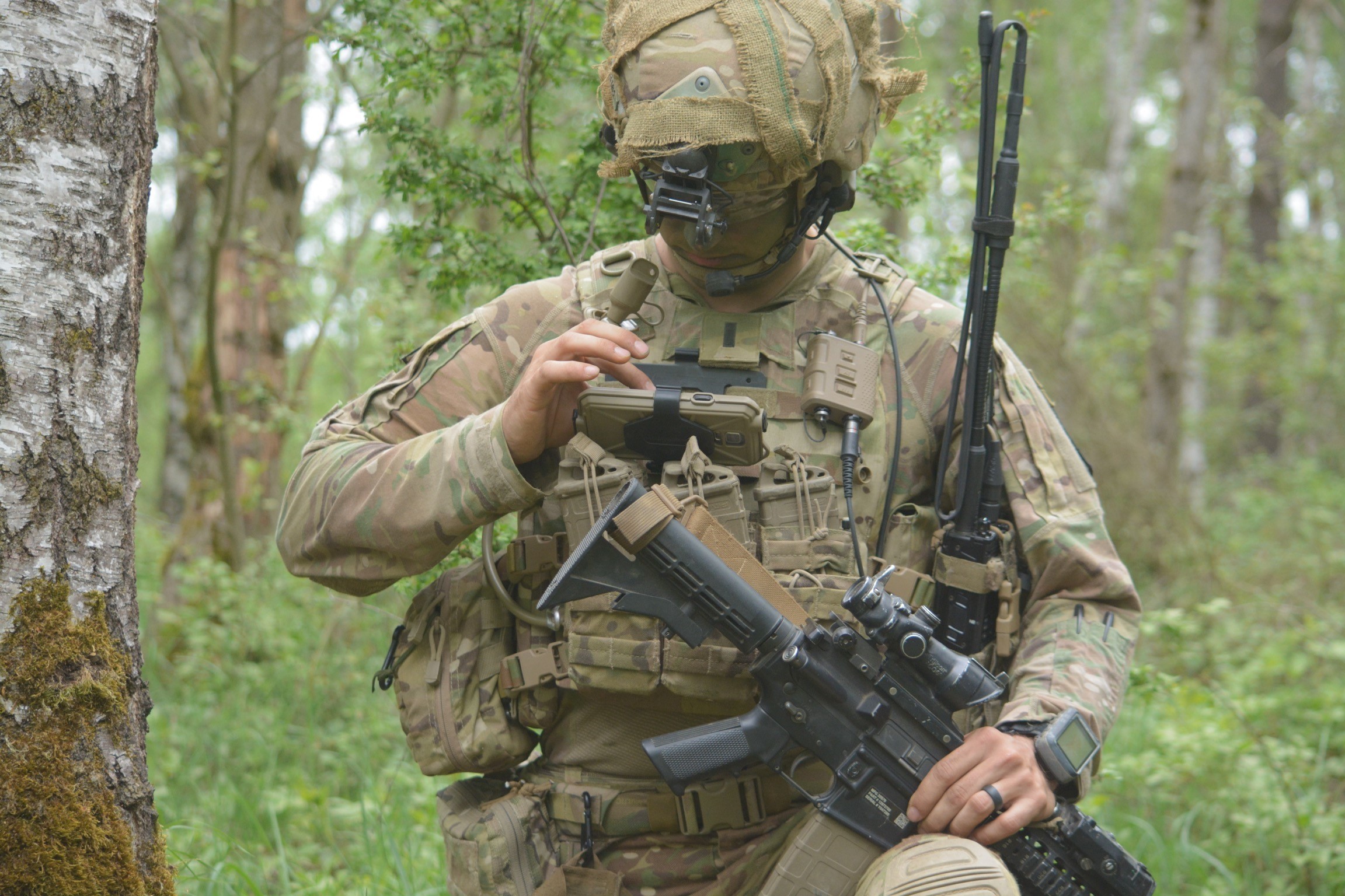 A soldier of the 173rd Airborne Brigade uses the End User Device to report information to his company commander through the Integrated Tactical Network during an exercise in Germany during 2018. (DVIDS)