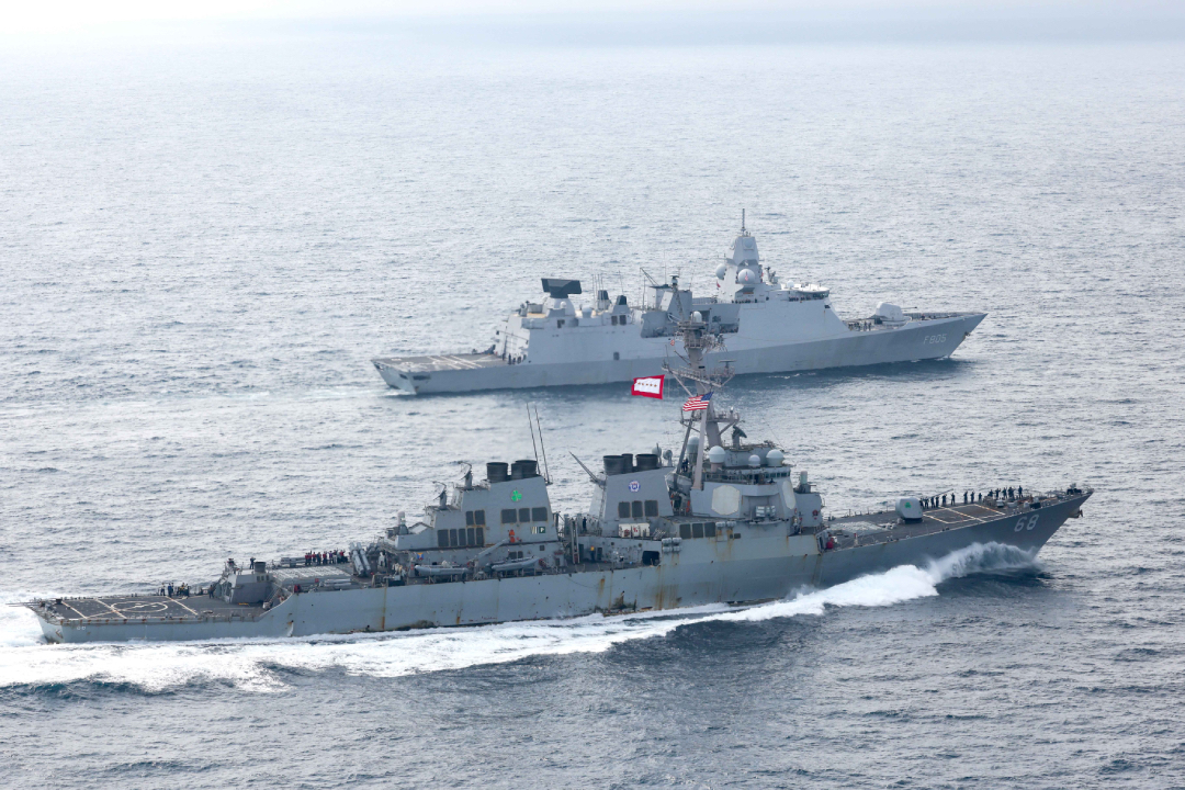 The Royal Netherlands Navy De Zeven Provincien-class air-defence and command frigate HNLMS Evertsen (rear) sails alongside the US Navy DDG 51 Flight I Arleigh Burke-class destroyer USS The Sullivans in the Indian Ocean in October 2021. The two ships were deployed as part of the RN’s HMS Queen Elizabeth carrier strike group (CSG), which deployed from the North Atlantic to the North Pacific and back between May and December 2021.