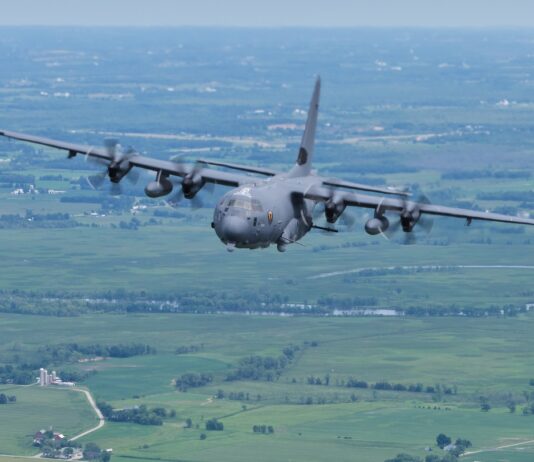The US military focuses on Venezuela High-altitude military transport aircraft landing on runway surrounded by forest, showcasing advanced aviation technology and defense capabilities.